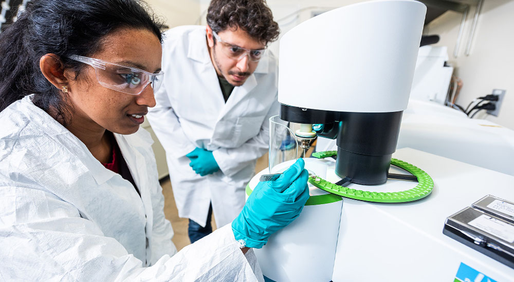 chemist in lab with student