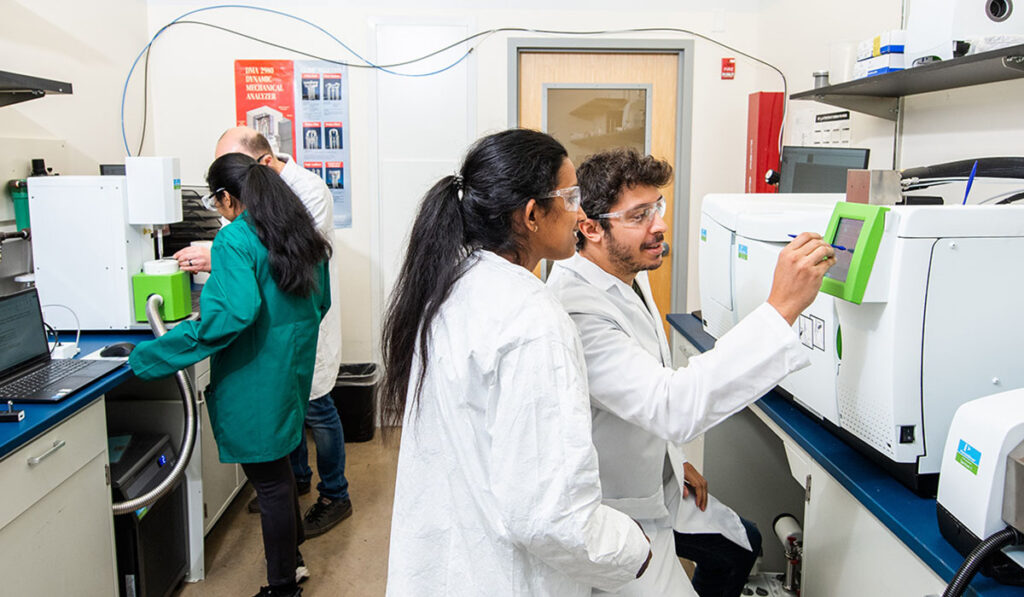 chemist in lab with student