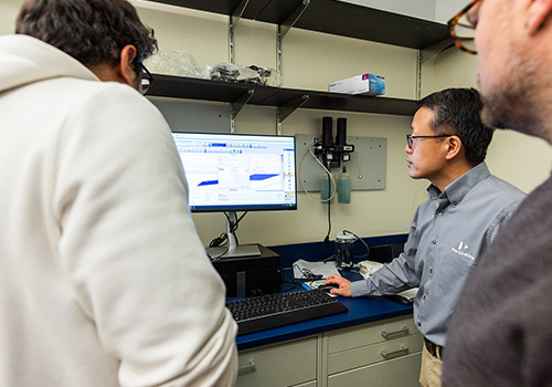 chemist in lab with student