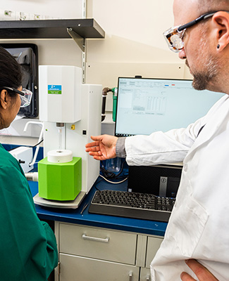 chemist in lab with student