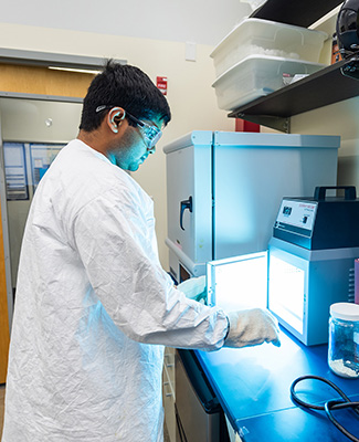 chemist in lab with student