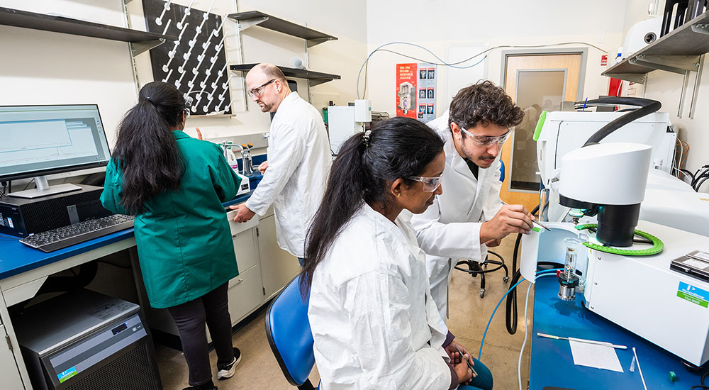 chemist in lab with student