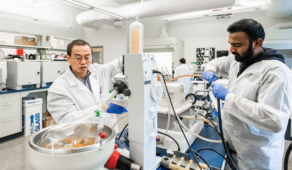 chemist in lab with student